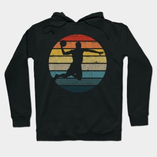 Basketball Player Silhouette On A Distressed Retro Sunset design Hoodie